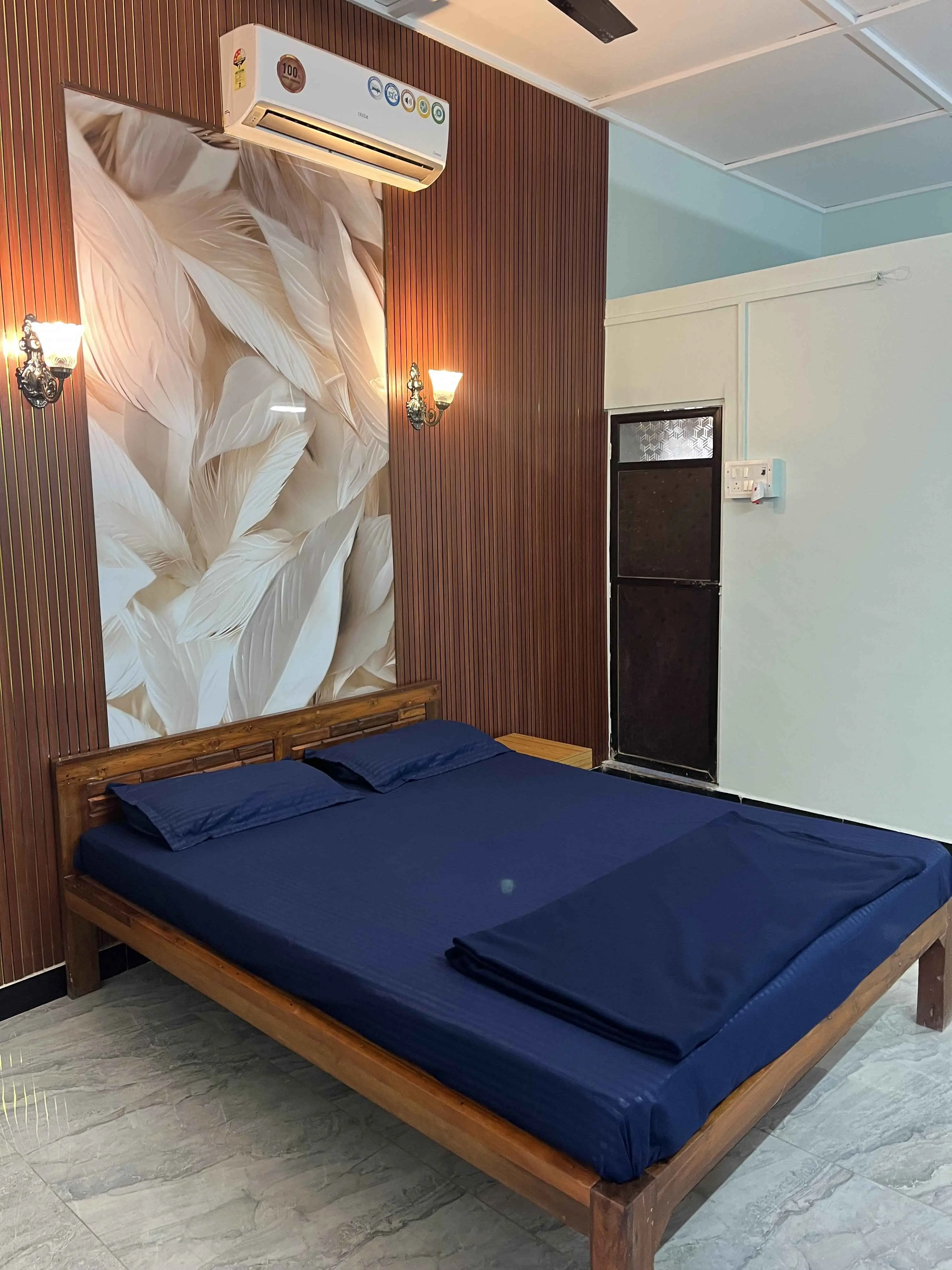 Spacious family-style room at Dolphin House Beach Resort used on a page about the best family resorts in Alibaug