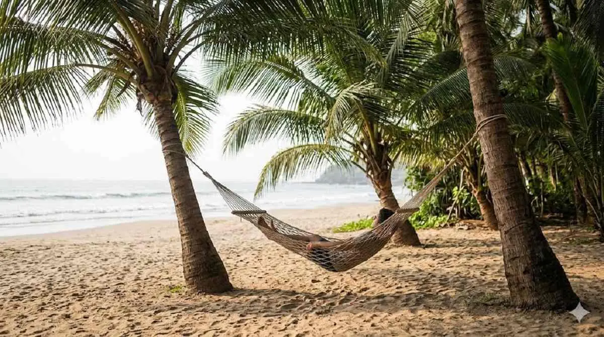 Quiet hammock scene on Kihim Beach showing the calm, low-crowd side of coastal travel that hidden beach searchers in Alibaug are often looking for